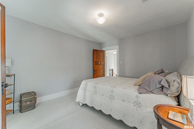 carpeted bedroom with baseboards