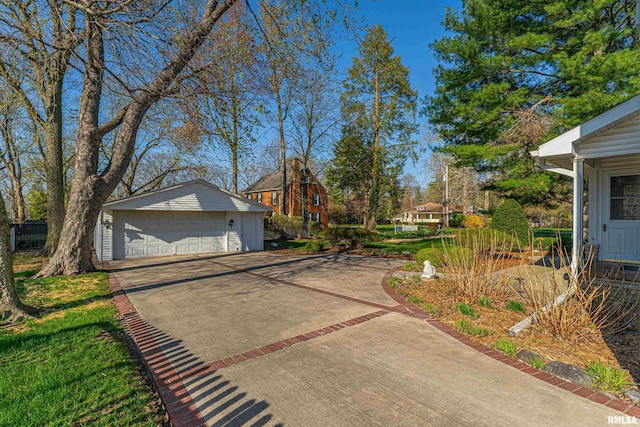 exterior space featuring an outbuilding and a detached garage