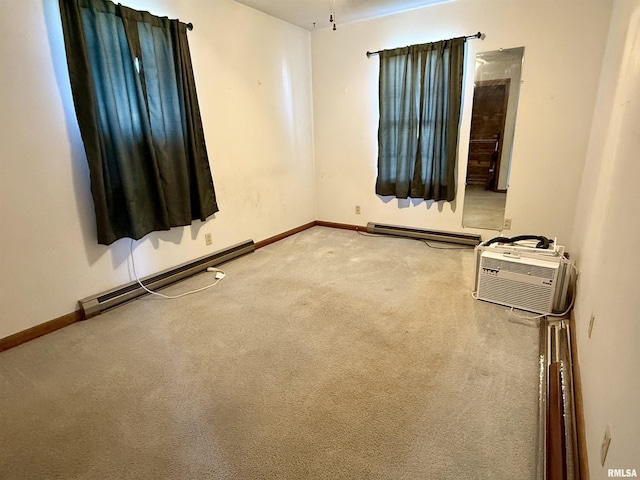 424 Lashmett Ct, Rushville, IL 62681 - spare room featuring a baseboard radiator, carpet flooring, baseboards, and a wall mounted AC