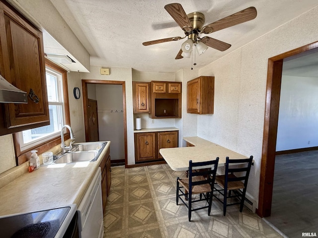 424 Lashmett Ct, Rushville, IL 62681 - kitchen with a sink, stove, white dishwasher, brown cabinets, and a textured ceiling