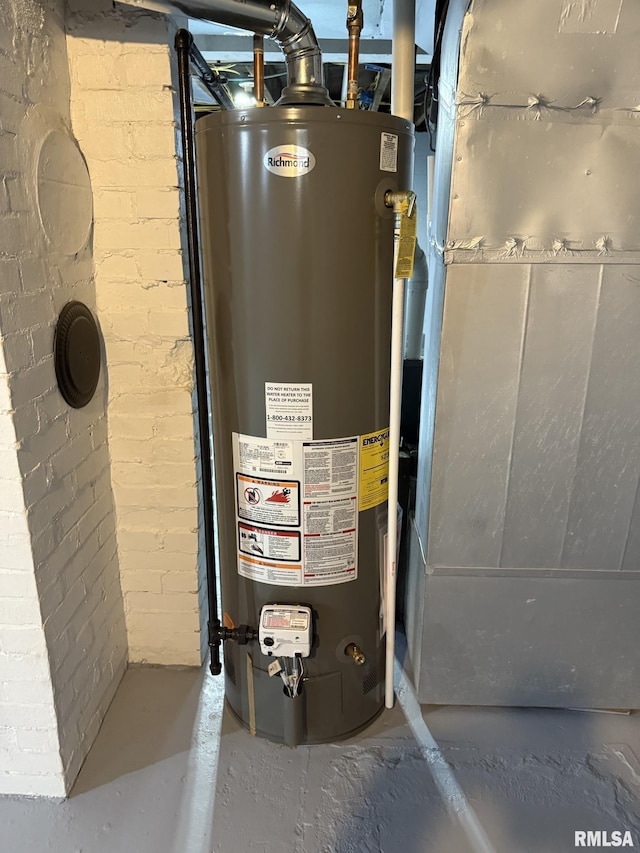 utility room featuring water heater