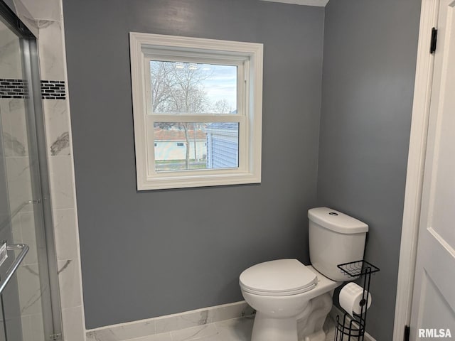 full bathroom with toilet, an enclosed shower, marble finish floor, and baseboards