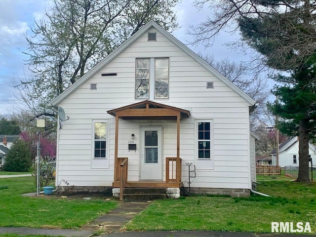 back of house with a yard
