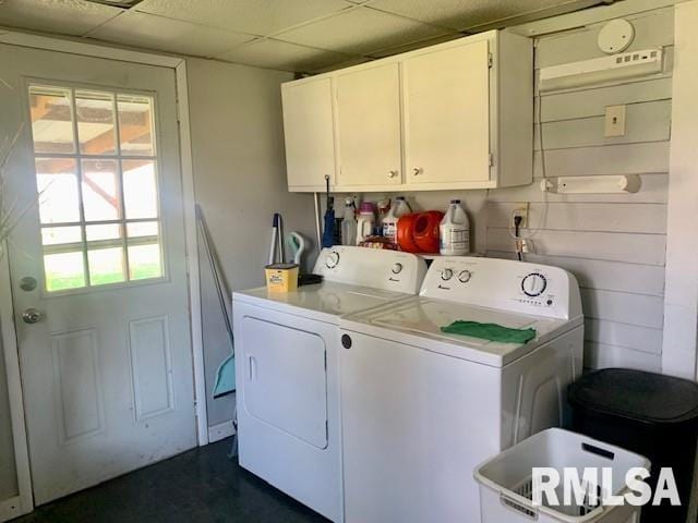 clothes washing area with cabinet space and washer and clothes dryer