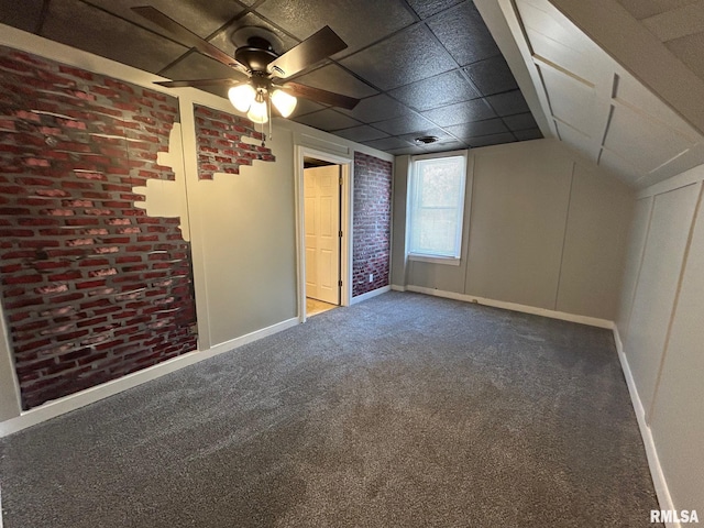 interior space with baseboards and a ceiling fan