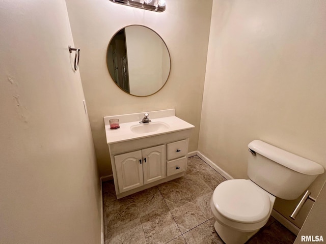 905 W Wind Rose Ln, Athens, IL 62613 - bathroom with toilet, vanity, and baseboards