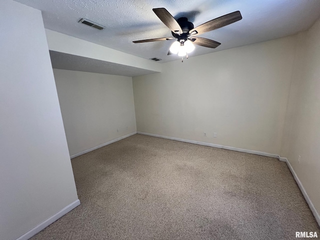 905 W Wind Rose Ln, Athens, IL 62613 - spare room with visible vents, light colored carpet, baseboards, and ceiling fan