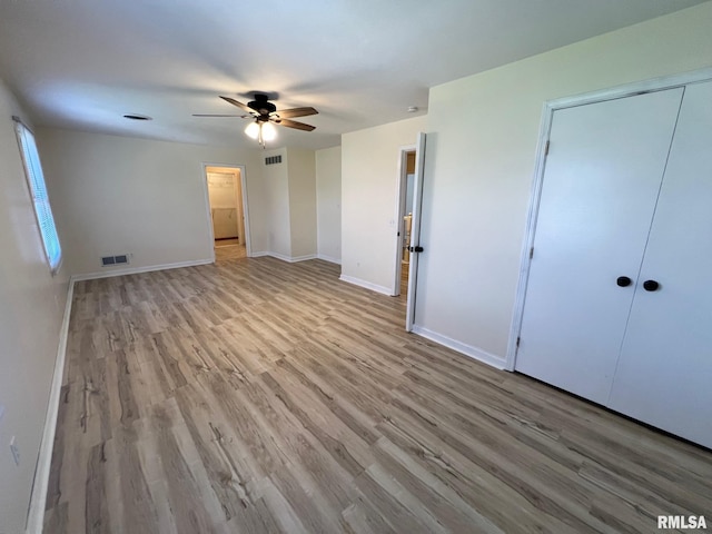 905 W Wind Rose Ln, Athens, IL 62613 - unfurnished bedroom featuring visible vents, baseboards, a ceiling fan, and light wood-style flooring