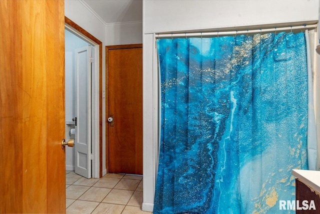 bathroom with ornamental molding, tile patterned floors, and curtained shower