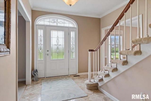 foyer with crown molding, a healthy amount of sunlight, baseboards, and stairs