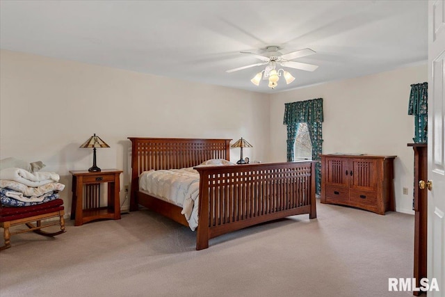 carpeted bedroom with a ceiling fan