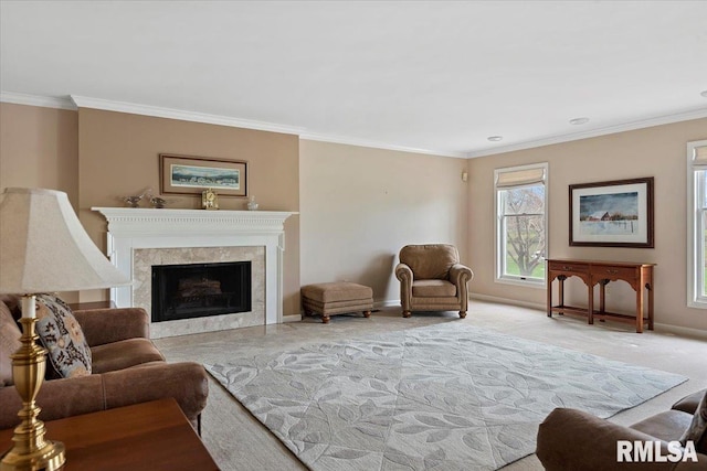 living area with baseboards, ornamental molding, and plenty of natural light
