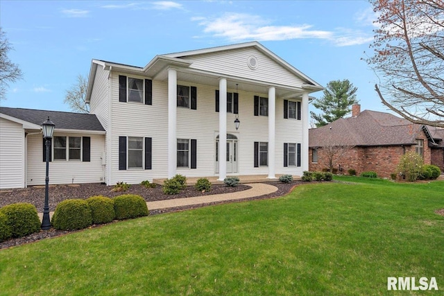 view of front of property with a front lawn
