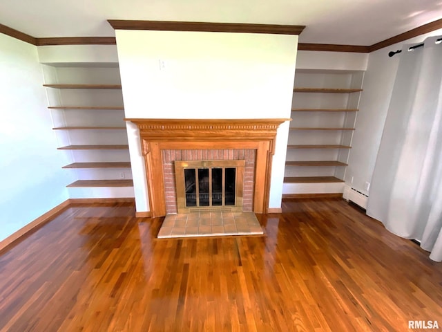 unfurnished living room featuring baseboards, a fireplace, crown molding, a baseboard radiator, and wood finished floors