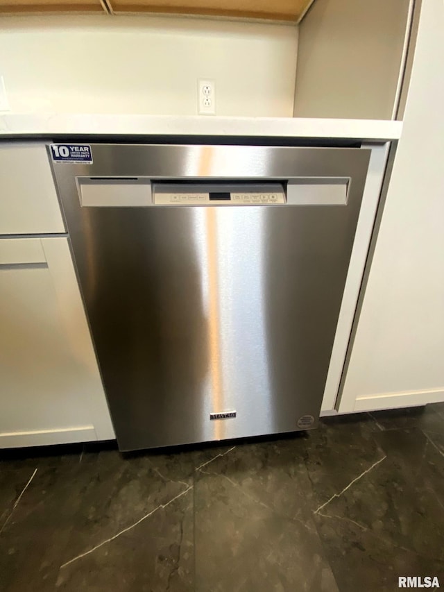 details with stainless steel dishwasher and white cabinets