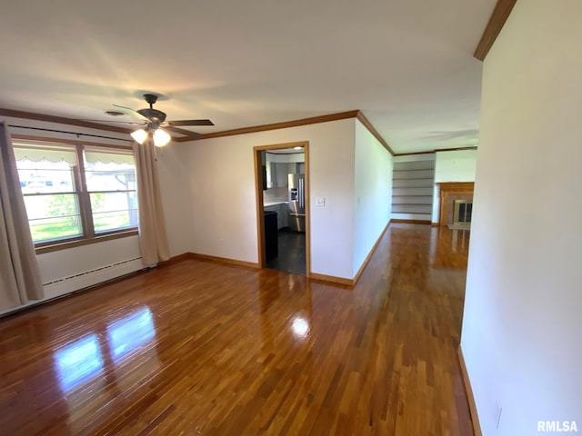 empty room featuring wood finished floors, baseboards, ornamental molding, and a brick fireplace