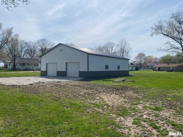 view of pole building with a yard