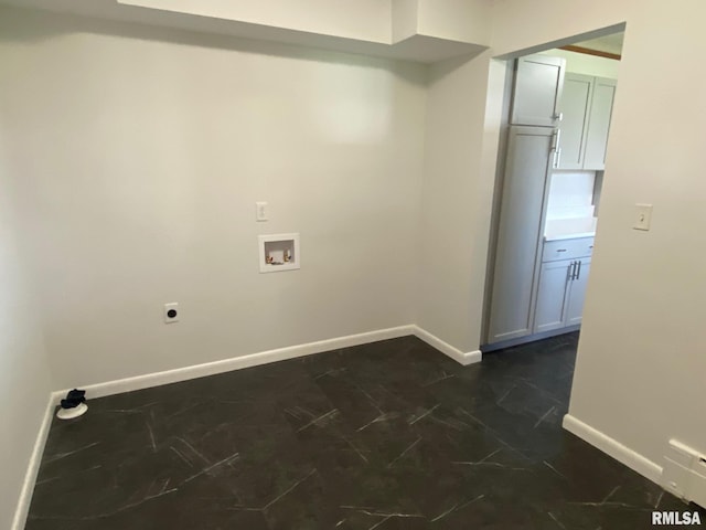 clothes washing area featuring baseboards, hookup for an electric dryer, hookup for a washing machine, and laundry area