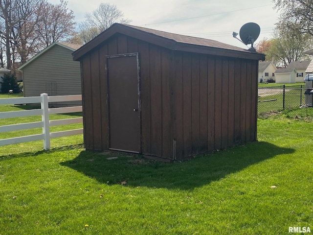 view of shed with fence