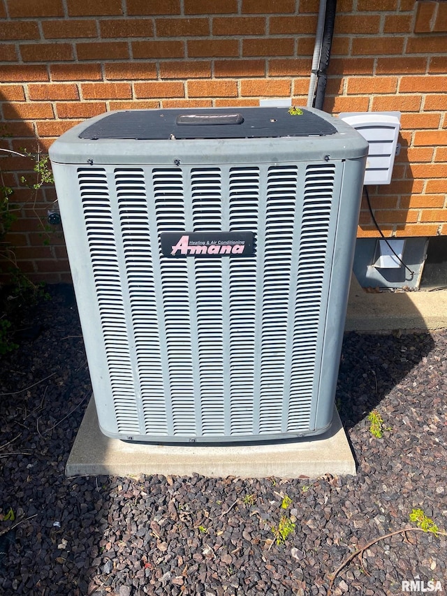 details with brick siding and central AC unit