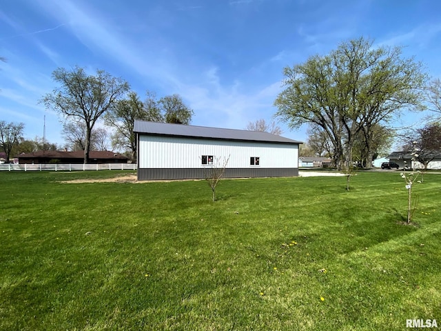 exterior space featuring fence and a lawn
