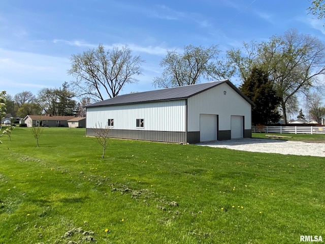 view of outbuilding featuring an outdoor structure and fence