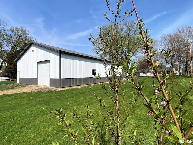 view of outdoor structure with an outbuilding and fence