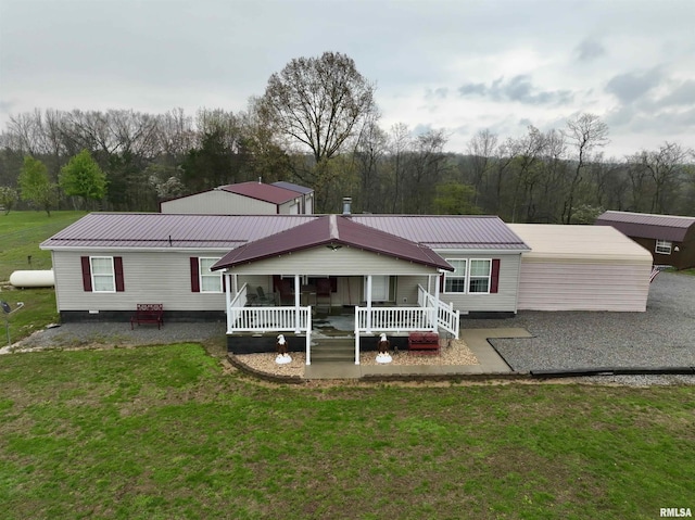 24 Davis Rd, Cave In Rock, IL 62919 - back of property featuring a porch, a yard, and metal roof