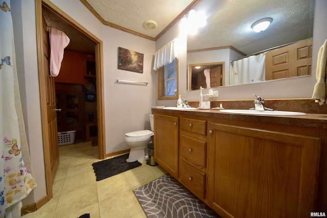 24 Davis Rd, Cave In Rock, IL 62919 - full bathroom with a sink, ornamental molding, toilet, a textured ceiling, and tile patterned floors