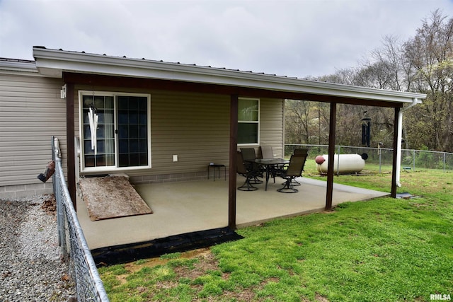 24 Davis Rd, Cave In Rock, IL 62919 - rear view of house with a patio area, metal roof, fence, and a yard