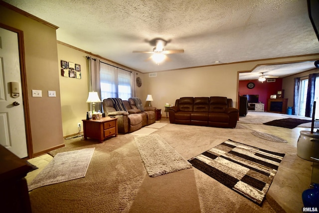 24 Davis Rd, Cave In Rock, IL 62919 - living area with visible vents, ornamental molding, a ceiling fan, a textured ceiling, and carpet flooring