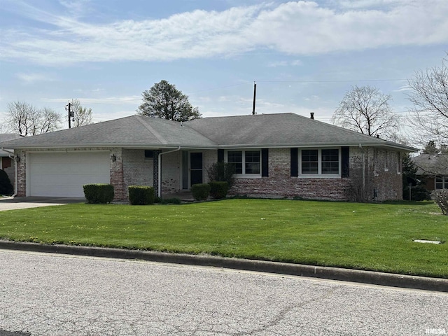ranch-style house featuring a garage, a front yard, driveway, and brick siding