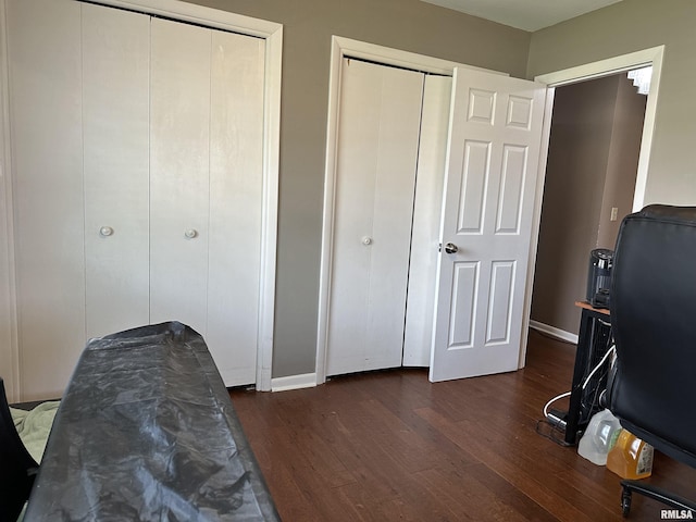 office space featuring dark wood-type flooring and baseboards