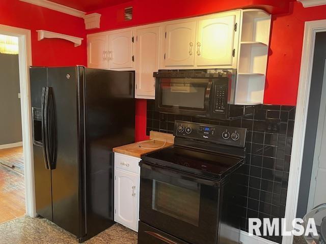 kitchen featuring tasteful backsplash, ornamental molding, white cabinets, open shelves, and black appliances