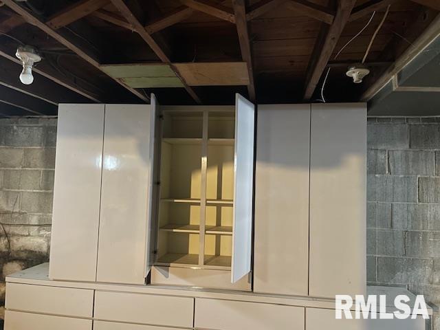 interior space featuring concrete block wall