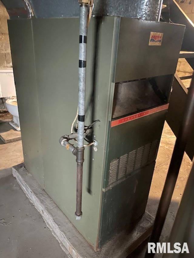 utility room with heating unit