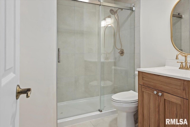 full bathroom with toilet, a stall shower, vanity, and tile patterned flooring