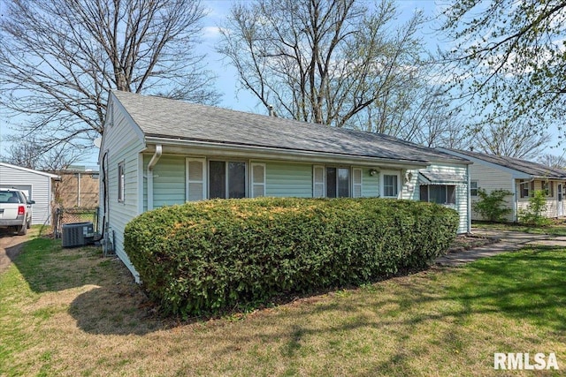 view of home's exterior featuring central AC and a lawn