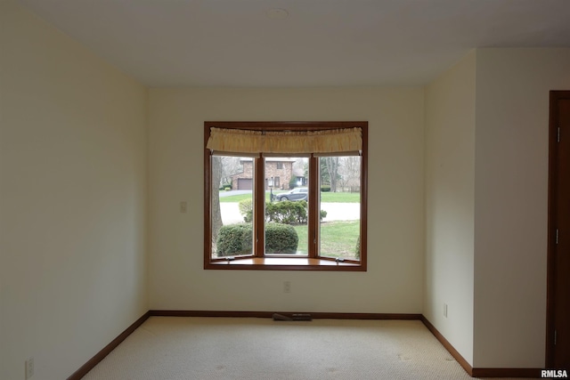 50 Hackberry Cir, Galesburg, IL 61401 - unfurnished room featuring light carpet and baseboards