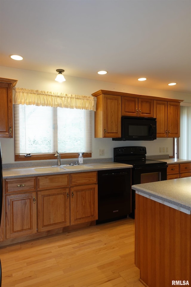 50 Hackberry Cir, Galesburg, IL 61401 - kitchen featuring black appliances, plenty of natural light, brown cabinetry, and recessed lighting