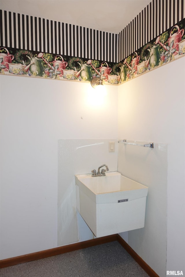 50 Hackberry Cir, Galesburg, IL 61401 - bathroom featuring baseboards and a sink