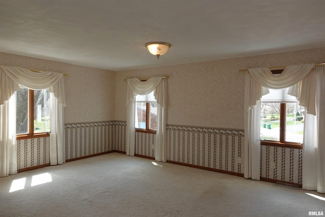50 Hackberry Cir, Galesburg, IL 61401 - unfurnished room with healthy amount of natural light, wallpapered walls, and carpet flooring