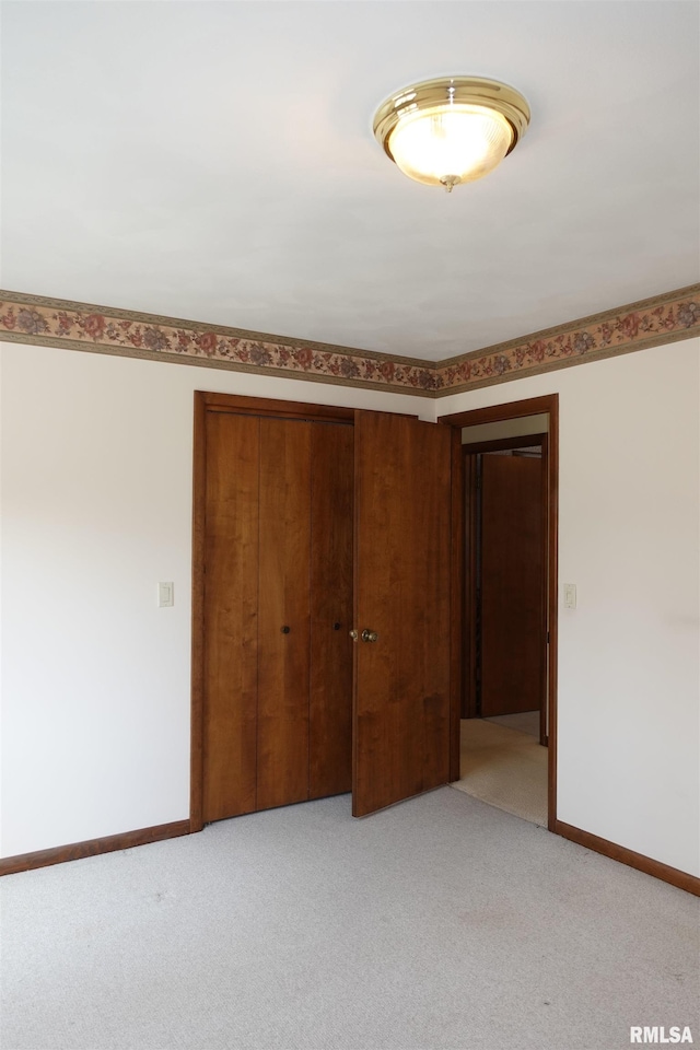 50 Hackberry Cir, Galesburg, IL 61401 - unfurnished bedroom with a closet and light carpet
