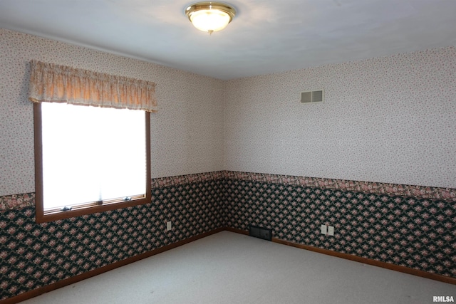 50 Hackberry Cir, Galesburg, IL 61401 - carpeted spare room with wallpapered walls
