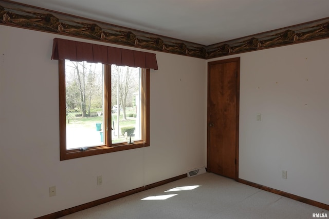 50 Hackberry Cir, Galesburg, IL 61401 - empty room with healthy amount of natural light and light colored carpet