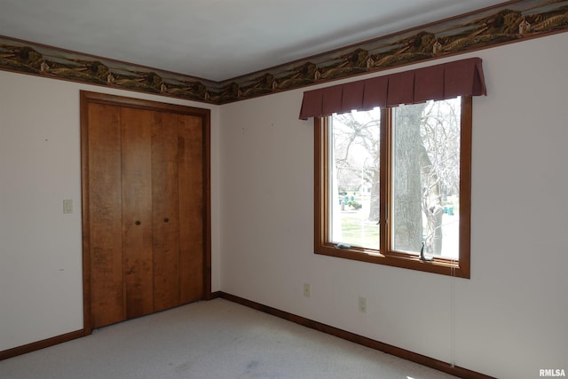 50 Hackberry Cir, Galesburg, IL 61401 - unfurnished bedroom featuring a closet and light colored carpet