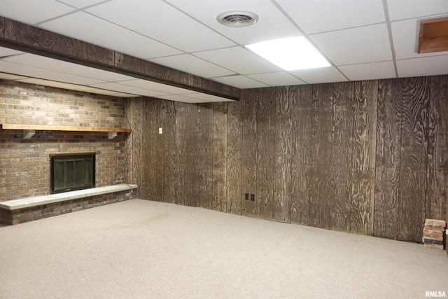 50 Hackberry Cir, Galesburg, IL 61401 - finished below grade area with a drop ceiling, carpet, wooden walls, and a fireplace