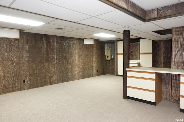 50 Hackberry Cir, Galesburg, IL 61401 - finished basement with carpet floors, a paneled ceiling, and wood walls