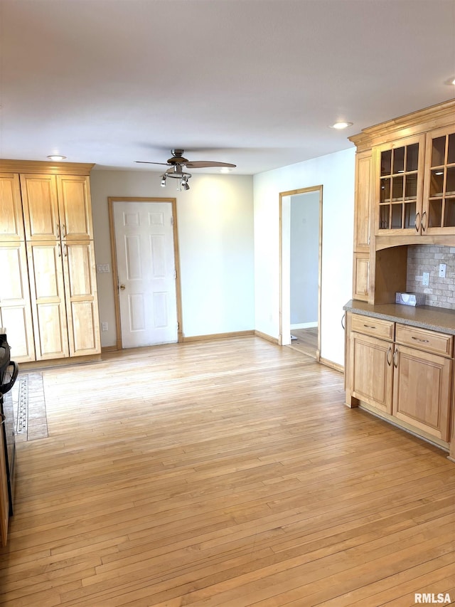 2110 Magnolia Dr, Jacksonville, IL 62650 - interior space featuring light wood-type flooring, ceiling fan, recessed lighting, and baseboards