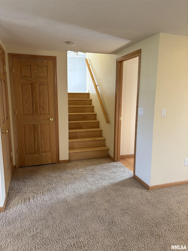 2110 Magnolia Dr, Jacksonville, IL 62650 - interior space featuring baseboards, stairway, and carpet flooring